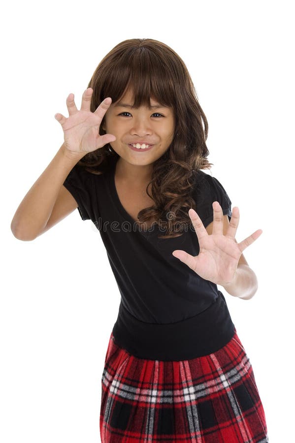 Cute girl acting like a cat stock images