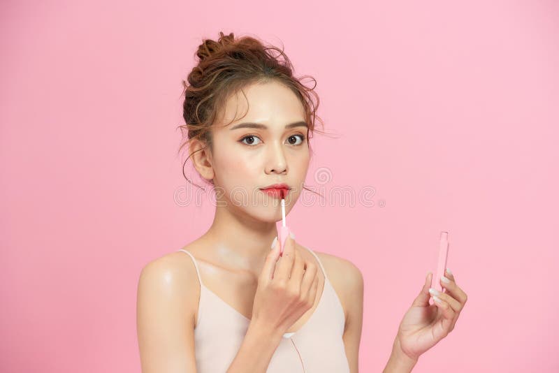Cute Girl Applying Lip Gloss Stock Image Image of vietnamese