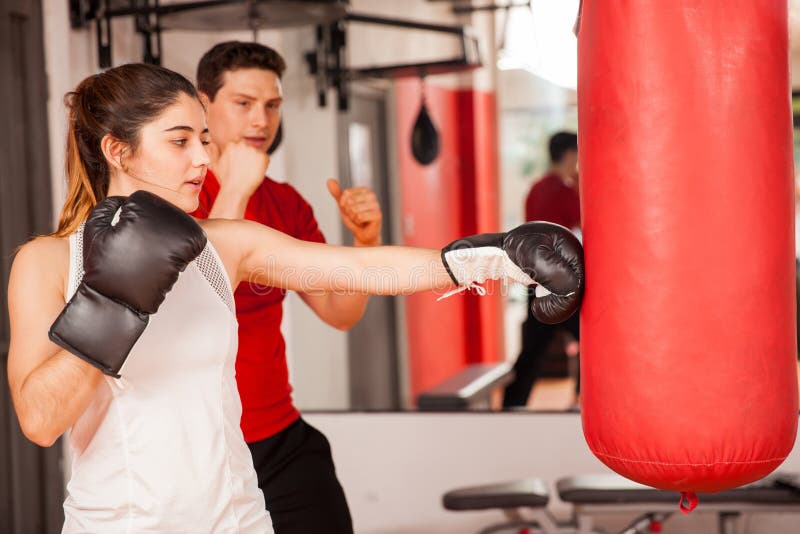 Cute Girl Boxing With A Personal Trainer Stock Photo