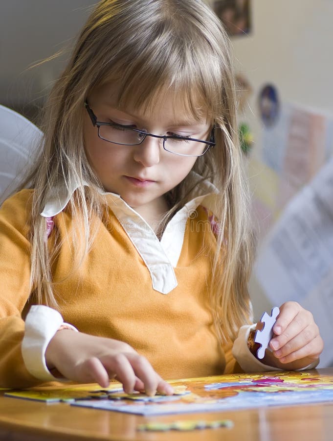 Cute Girl Doing Jigsaw Puzzle Stock Image Image of glasses, game 6567531