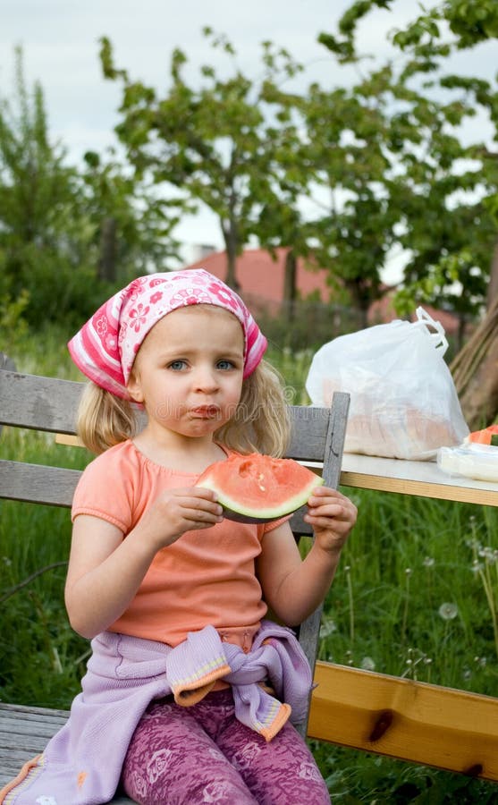 Cute girl eating watermelon