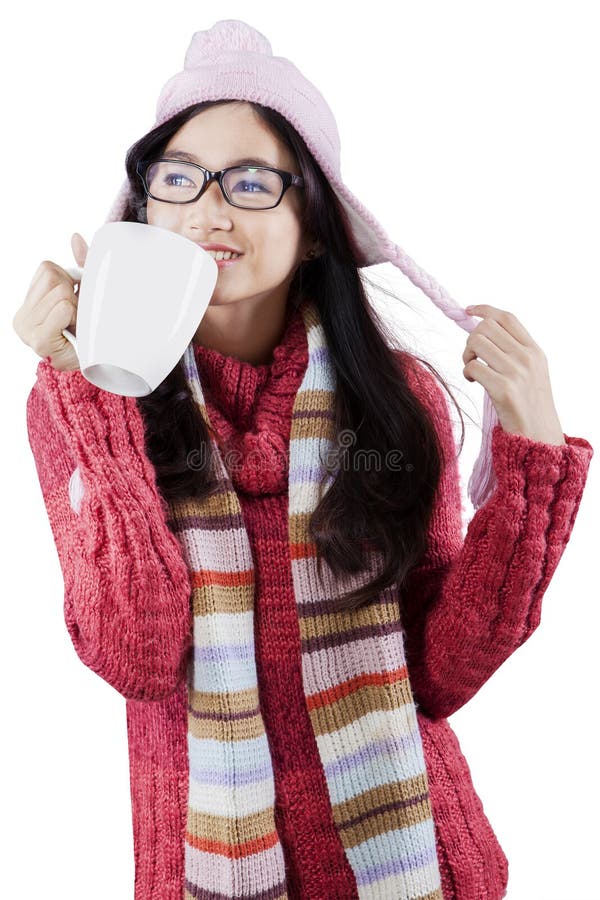 Cute girl enjoy hot drink in studio