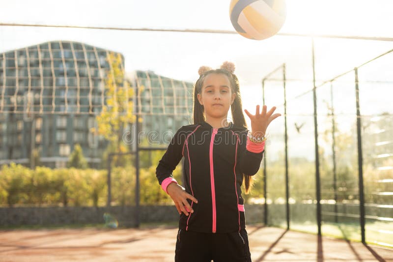 Cute Girl Playing Ball. Girl with a Blue-yellow Volleyball Stock Image ...