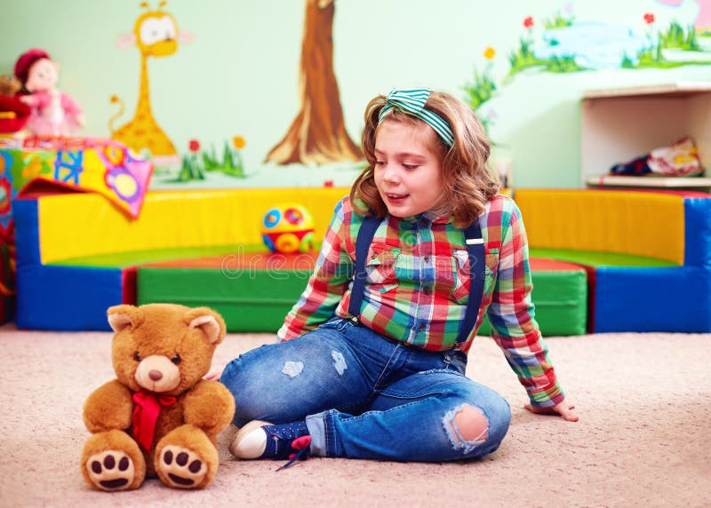 Cute girl playing in kindergarten for kids with special needs royalty free stock photography Cute girl playing in kindergarten for kids with special needs royalty free stock photography