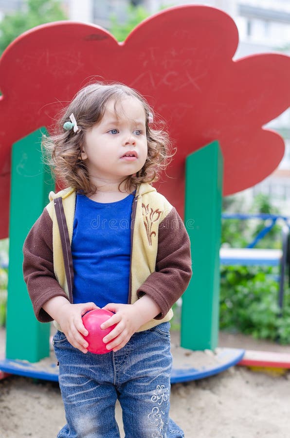 Cute Girl with a Red Ball on the Playground Stock Photo Image of