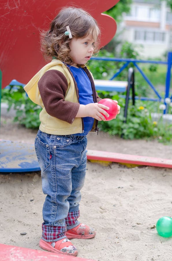 Cute Girl with a Red Ball on the Playground Stock Image Image of cute