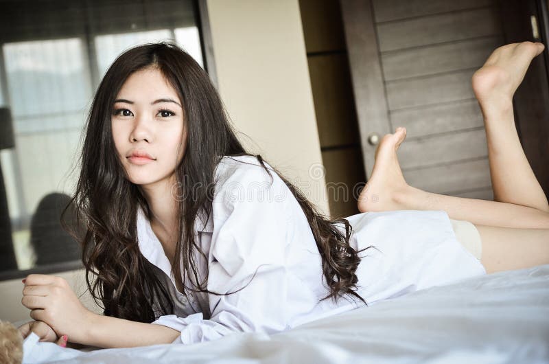 Cute girl relaxing on bed