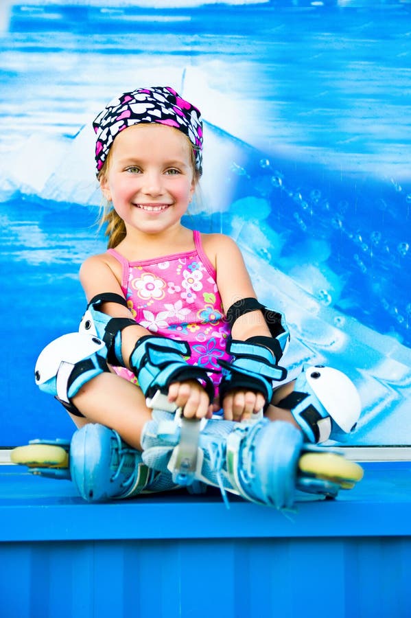 Cute girl in roller skates stock image. Image of practice 20357649