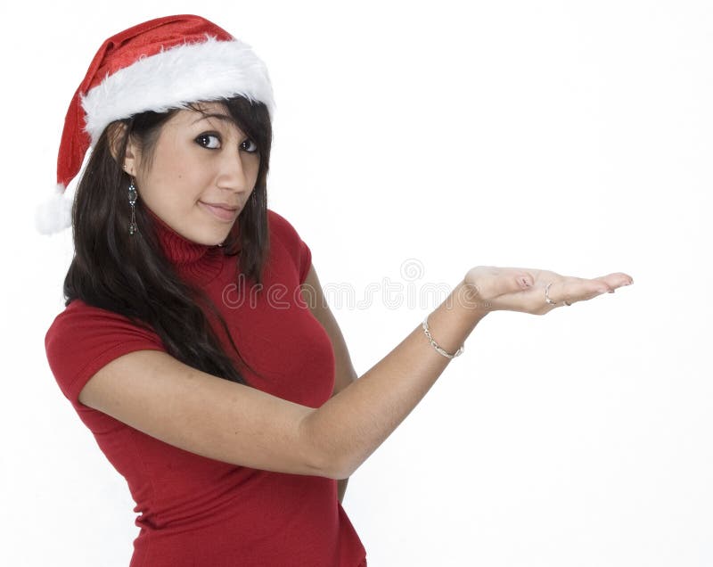 Cute Girl In A Santa Hat Holding ...