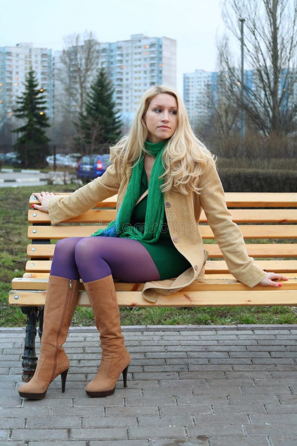 Cute Girl Sitting on a Bench. Stock Photo - Image of beauty, blonde ...