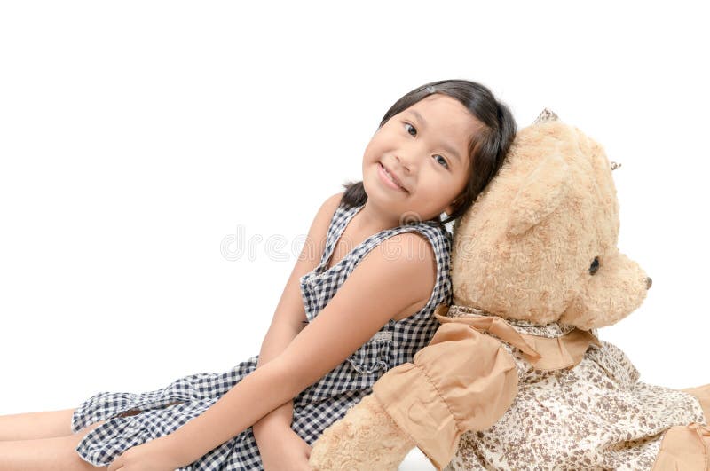 Cute girl sitting with big teddy bear isolated stock images Cute girl sitting with big teddy bear isolated stock images