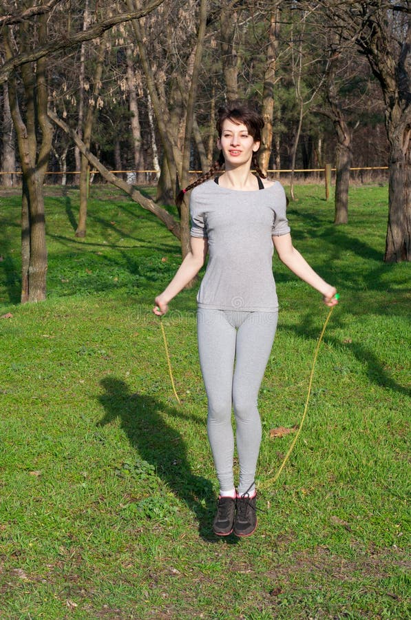 Cute girl with a skipping rope royalty free stock images Cute girl with a skipping rope royalty free stock images