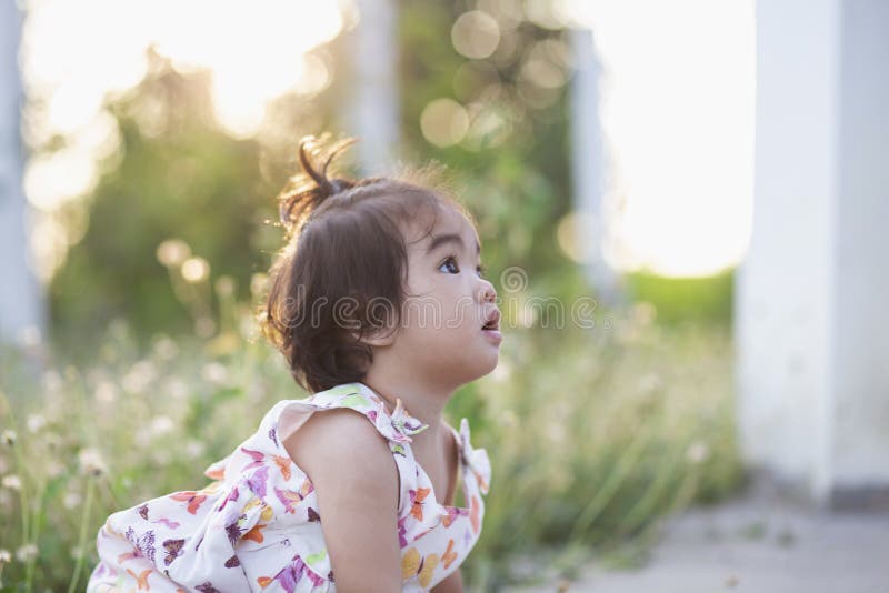 Cute Girl Smiling Brightly in the Setting Sun Stock Photo - Image of ...