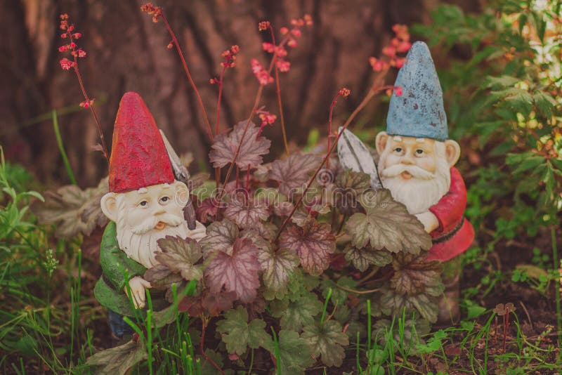 Cute gnomes garden model, gardener with scissors