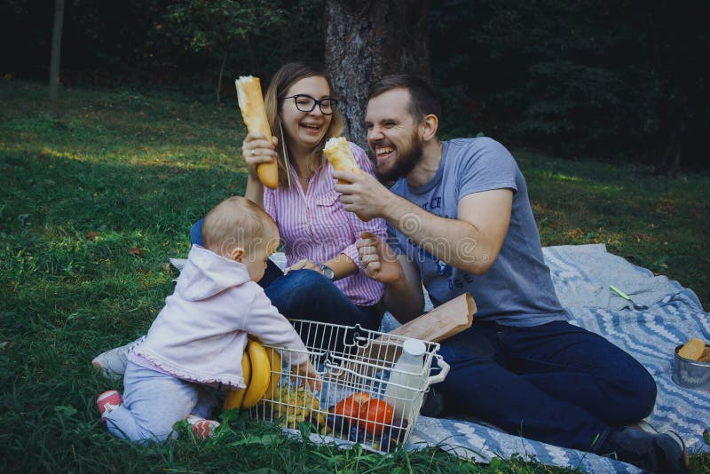 Cute happy family on picnic stock images Cute happy family on picnic stock images