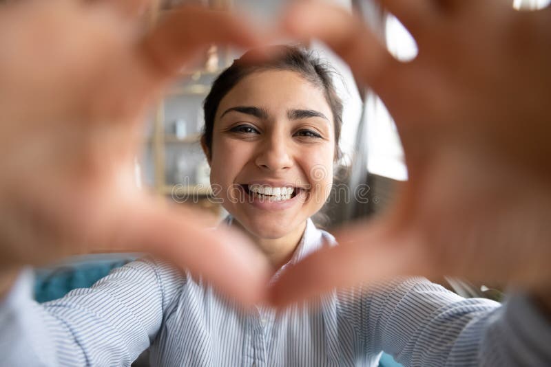 Cute Happy Indian Girl Making Heart Shape Looking at Camera Stock Photo -  Image of model, hand: 168475446