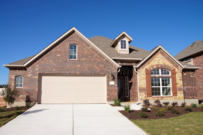 Cute house brick stone blue sky