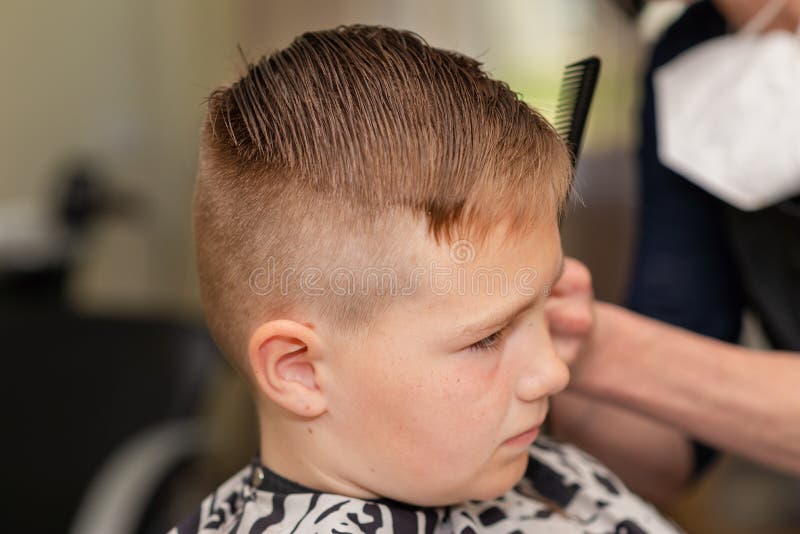 Cute Kid Boy Have Hair Cut, Professional Barber Doing Haircut. Hairdress  for Children. Side View Portrait Barbershop Stock Photo - Image of  hairstylist, hairstyle: 222277088