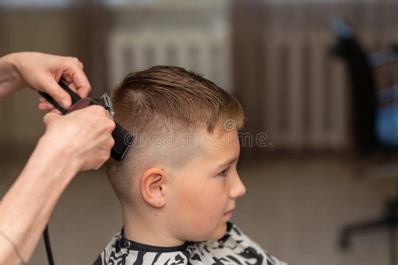 Cute Kid Boy Have Hair Cut, Professional Barber Doing Haircut. Hairdress for Children. Side View Portrait Barbershop Stock Photo - Image of indoor, fashion: 224391822 Cute Kid Boy Have Hair Cut, Professional Barber Doing Haircut. Hairdress for Children. Side View Portrait Barbershop Stock Photo - Image of indoor, fashion: 224391822