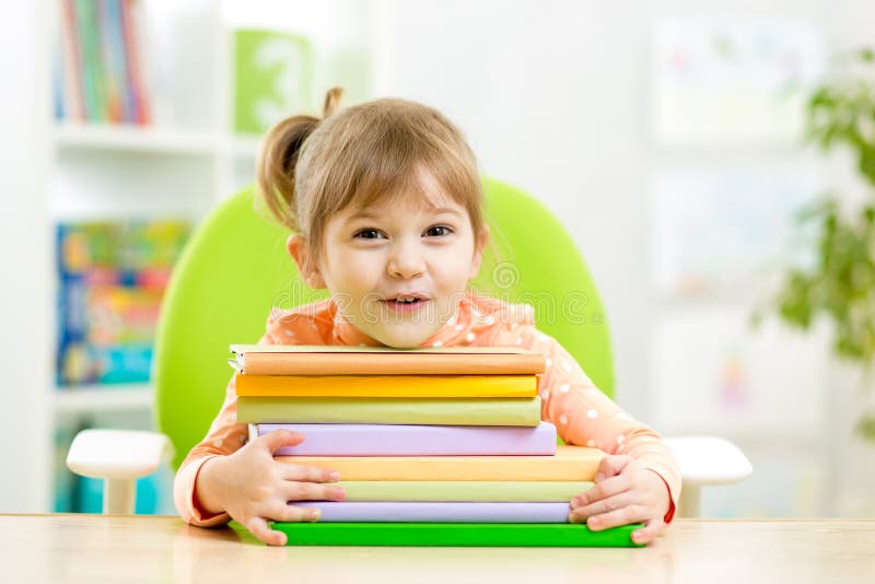 Cute kid girl preschooler with books stock images Cute kid girl preschooler with books stock images