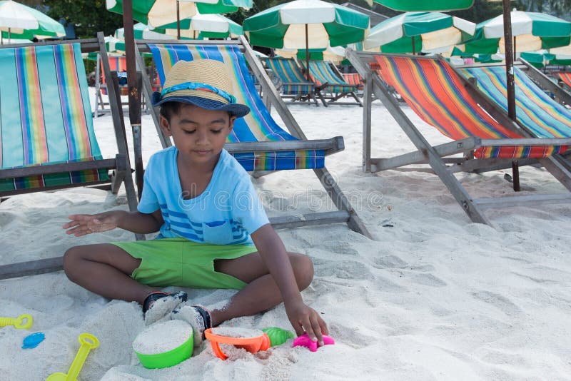 Cute little asian boy play sand royalty free stock image