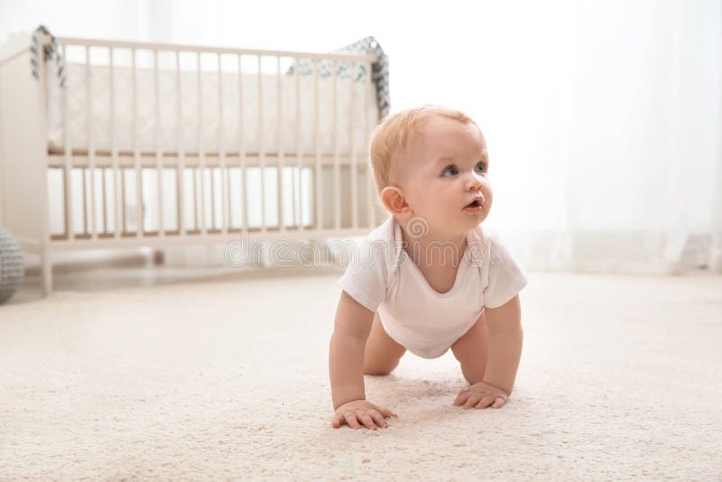 Cute little baby crawling on carpet royalty free stock images Cute little baby crawling on carpet royalty free stock images