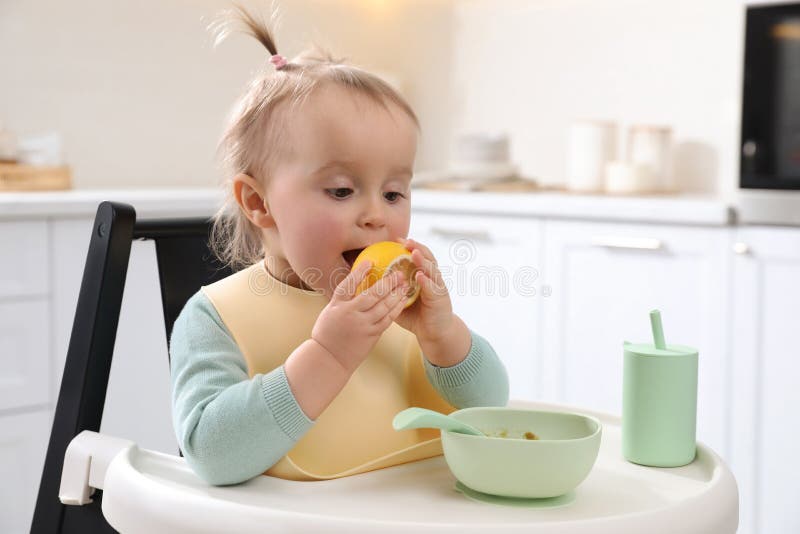Cute Little Baby with Lemon in High Chair at Kitchen Stock Photo Image of dinner, caucasian