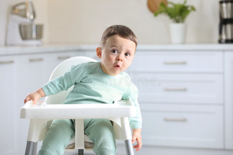 Cute Little Baby Sitting in High Chair at Kitchen. Space for Text Stock Image Image of happy