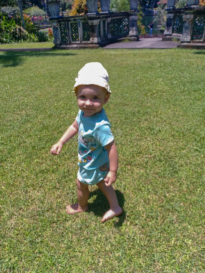 Cute little baby smiling and play in park stock photos Cute little baby smiling and play in park stock photos