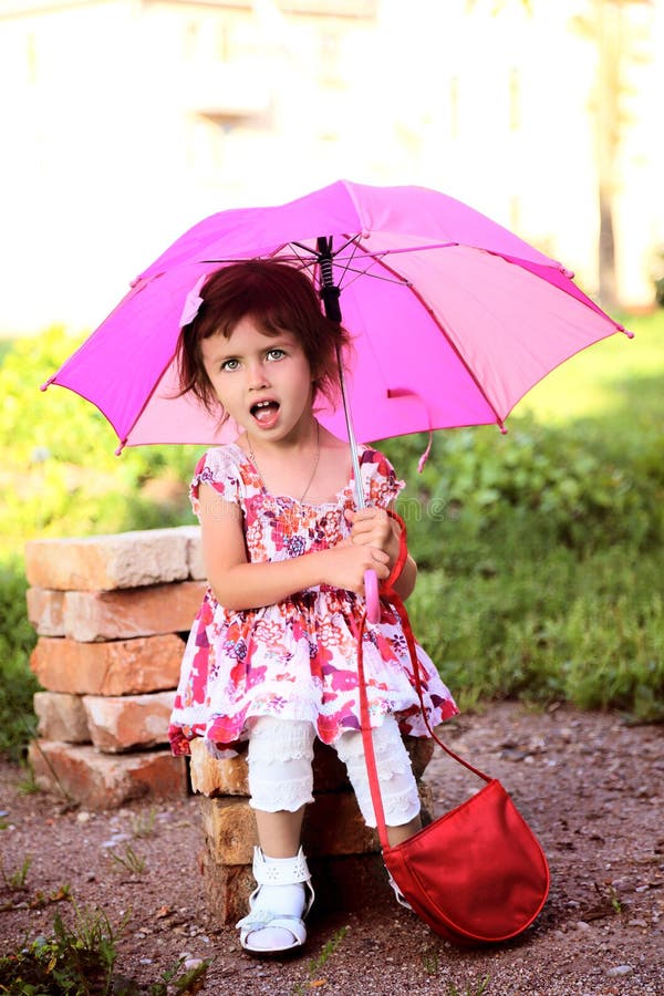 Cute Little Beautiful Girl with Pink Umbrella and Handbag in Park Stock ...