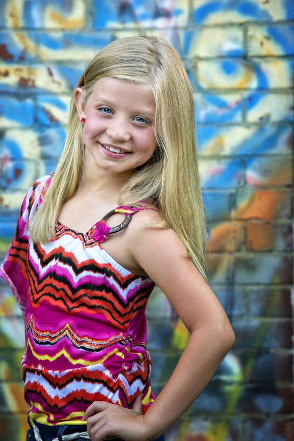 Cute Little Blonde Girl At Graffiti Wall Stock Image I