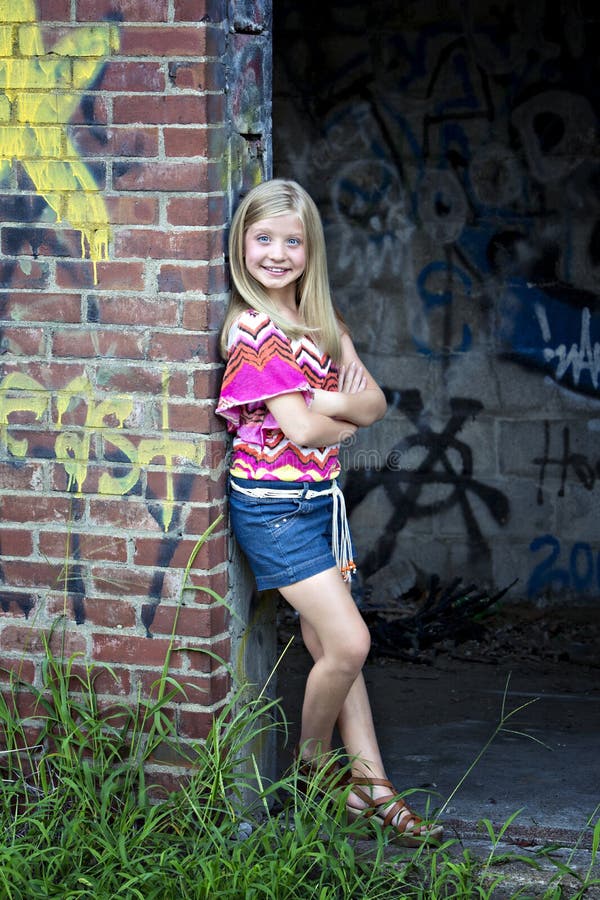 Cute Little Blonde Girl At Graffiti Wall Stock Images