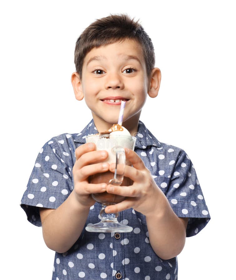 Cute little boy with cup of hot cocoa drink on white background. 