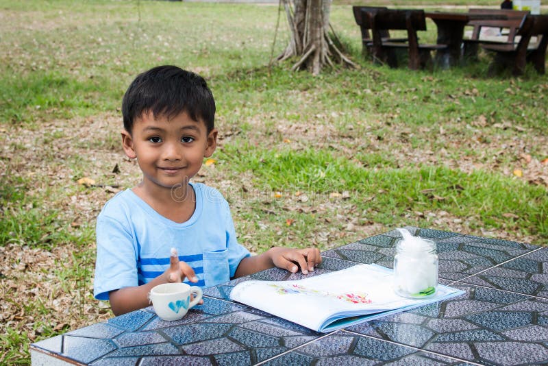 Cute little boy do homework arts stock images