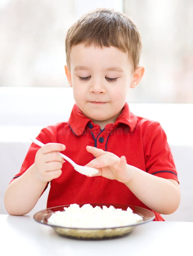 Cute Little Boy is Eating Cottage Cheese Stock Photo Image of cute