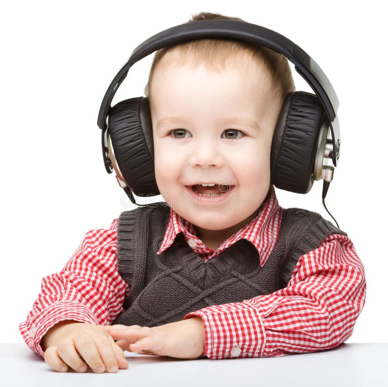 Cute Little Boy Enjoying Music Using Headphones Stock Photo Image of