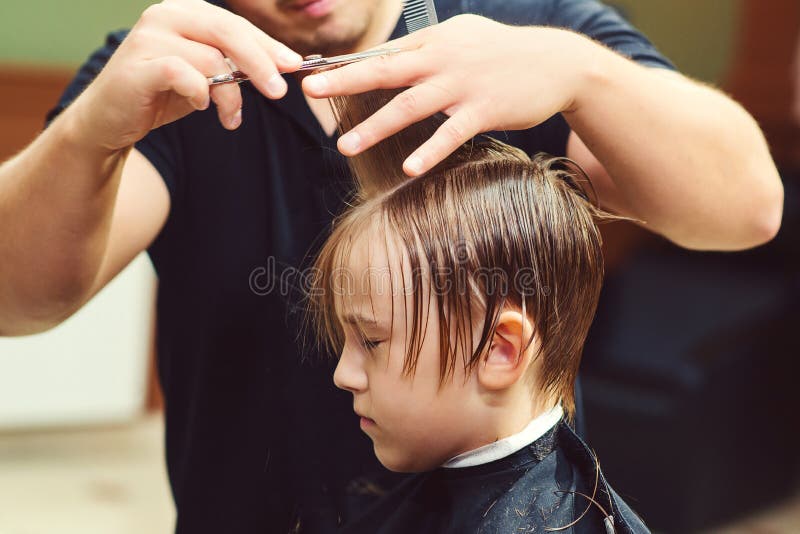 Cute Little Boy Getting Haircut by Hairdresser at the Barbershop. Barber Man Doing Kid the Hairstyle Stock Image - Image of stylish, razor: 196395653 Cute Little Boy Getting Haircut by Hairdresser at the Barbershop. Barber Man Doing Kid the Hairstyle Stock Image - Image of stylish, razor: 196395653