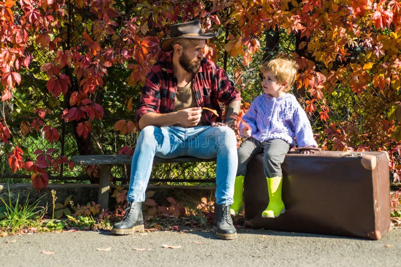 Cute little boy with his father during stroll in the forest. Dad and son in the autumn park play laughing. Childhood royalty free stock photos Cute little boy with his father during stroll in the forest. Dad and son in the autumn park play laughing. Childhood royalty free stock photos
