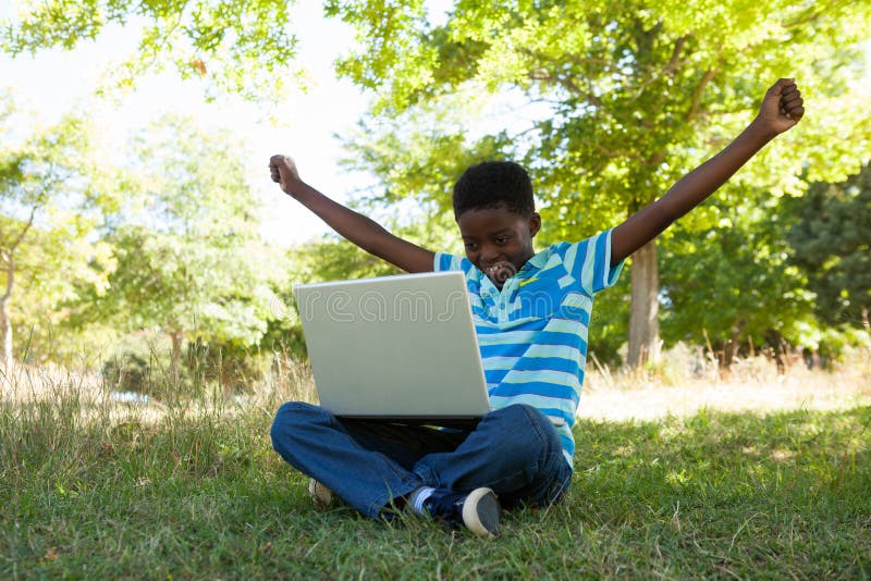 Cute little boy with laptop