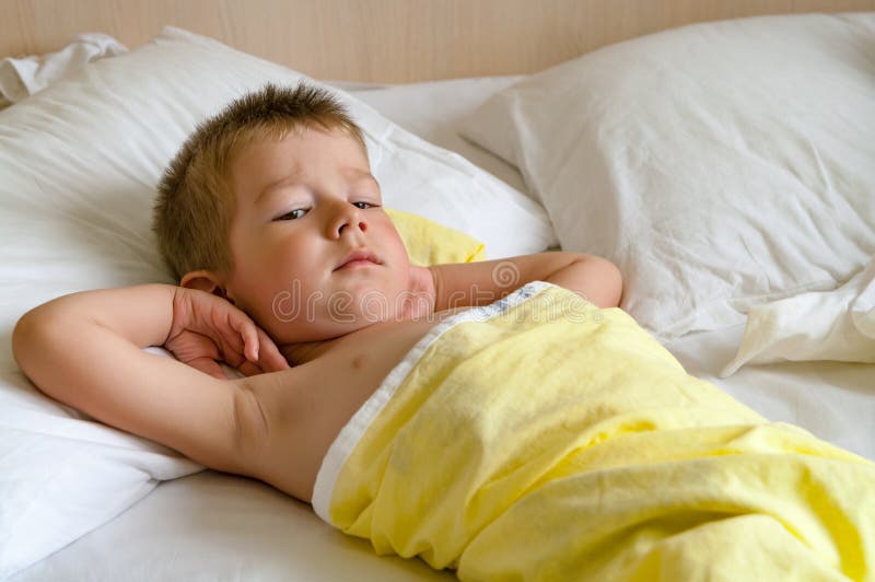 Cute little boy in bed stock image. Image of cute, night 153795955