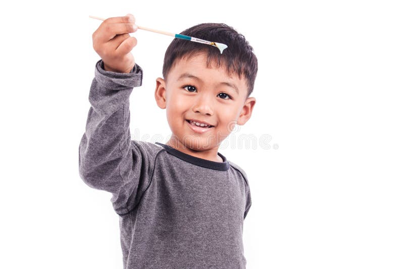 Cute little boy play paintbrush stock image