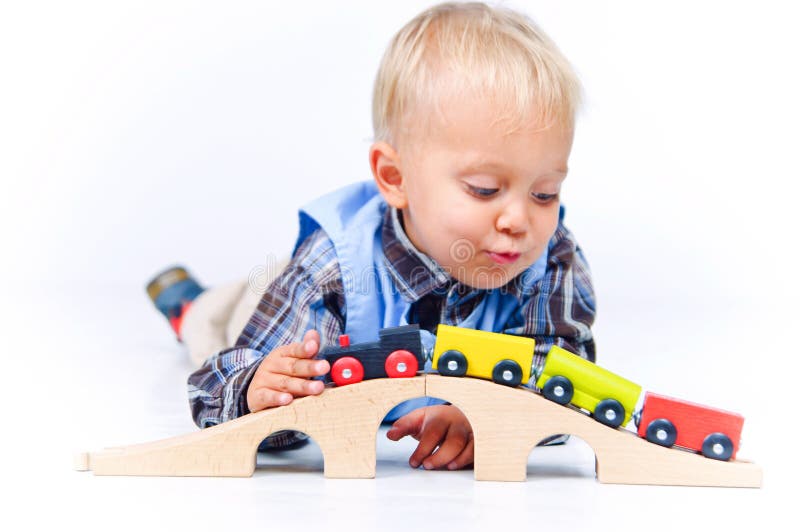 Cute Little Boy Playing Trains Stock Image Image of background, blue