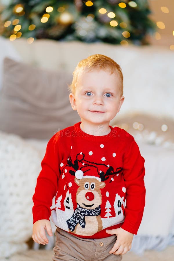 Cute Little Boy in a Red Christmas Sweater. Traditional Clothes and Gifts  Stock Photo - Image of gifts, claus: 236603904
