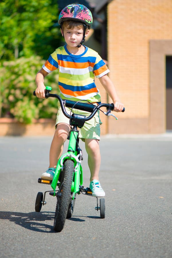 little boy riding bike