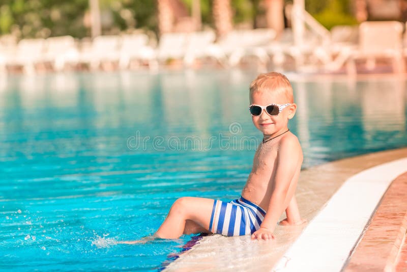 Cute Little Boy Sitting at the Pool Stock Photo Image of activity