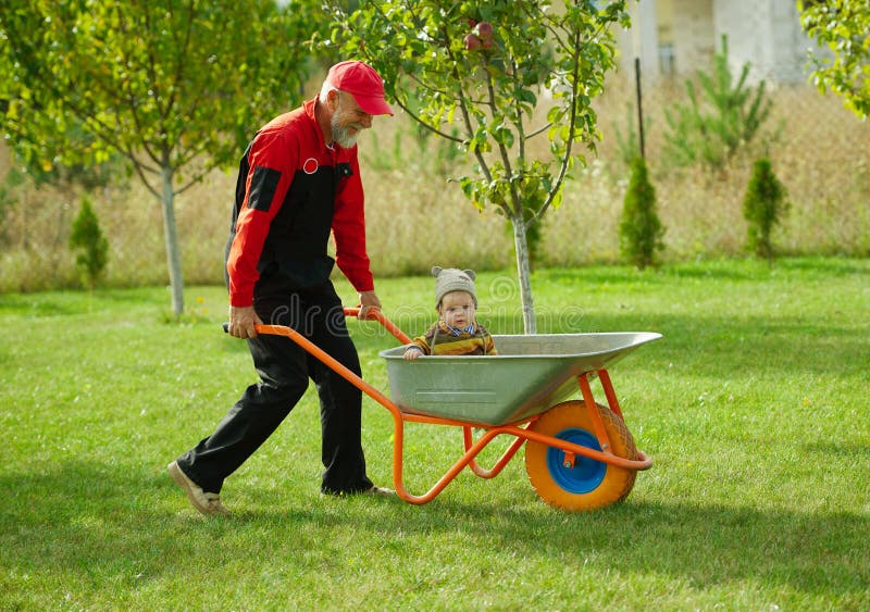 Cute Boy And Wheelbarrow Stock Image Image Of Caucasian 8245535