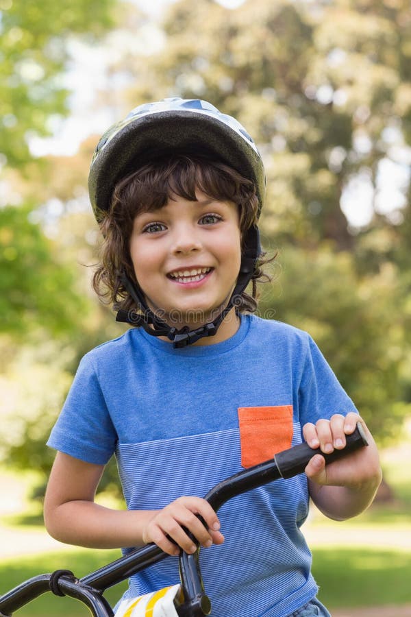 Cute little boy wearing bicycle helmet