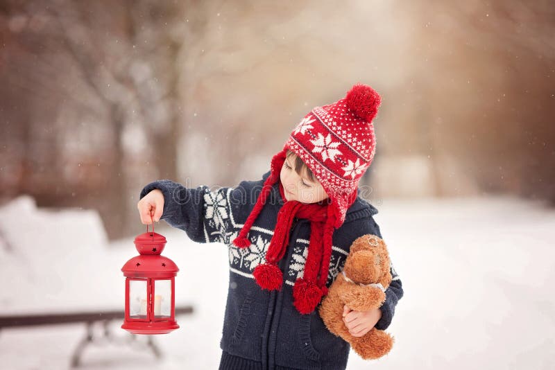 Cute Little Caucasian Boy With Teddy Bear And Red Lantern, Playing In The Winter Park Stock