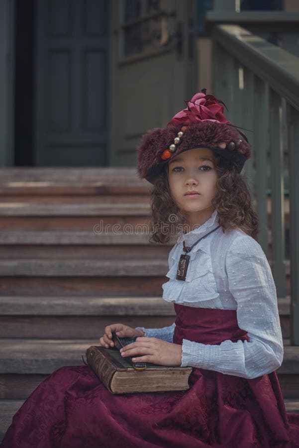Cute little caucasian girl wearing retro clothes. Nice female child in beautiful vintage dress. stock image Cute little caucasian girl wearing retro clothes. Nice female child in beautiful vintage dress. stock image