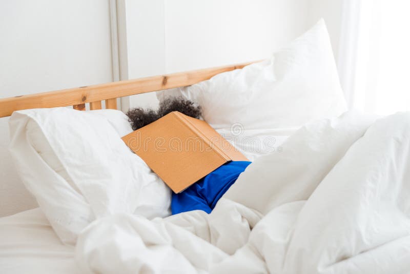 A cute little child African American girl sleeping and lazy when reading the book royalty free stock photography A cute little child African American girl sleeping and lazy when reading the book royalty free stock photography